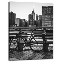 Obraz na płótnie Architektura Rower na tle miasta 30x40 cm